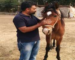 He is a person who loves to do horse riding.